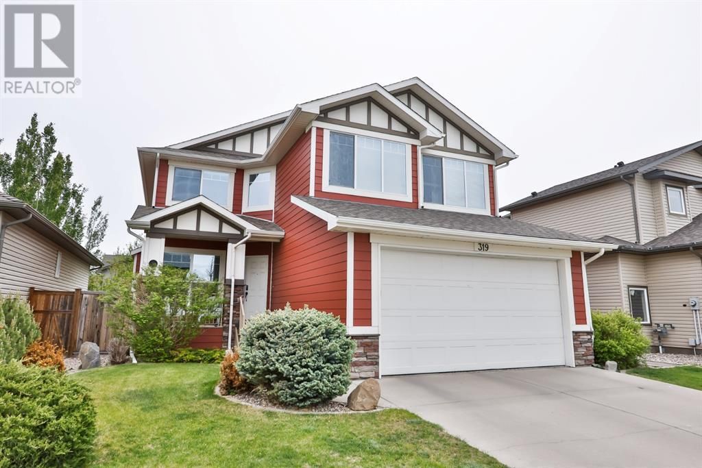 Main Photo: 319 Couleecreek Court S in Lethbridge: House for sale : MLS®# A2032009