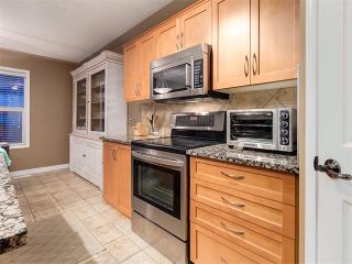 Photo 8: 40 COUGARSTONE Manor SW in Calgary: Cougar Ridge House for sale : MLS®# C4087798