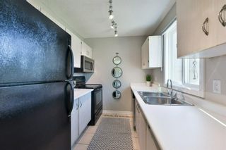 Photo 13: 1301 829 Coach Bluff Crescent in Calgary: Coach Hill Row/Townhouse for sale : MLS®# A1094909