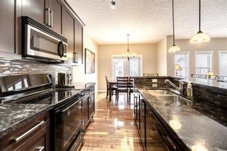 Photo 7: 325 BRIDLERIDGE View SW in Calgary: Bridlewood House for sale : MLS®# C4177139