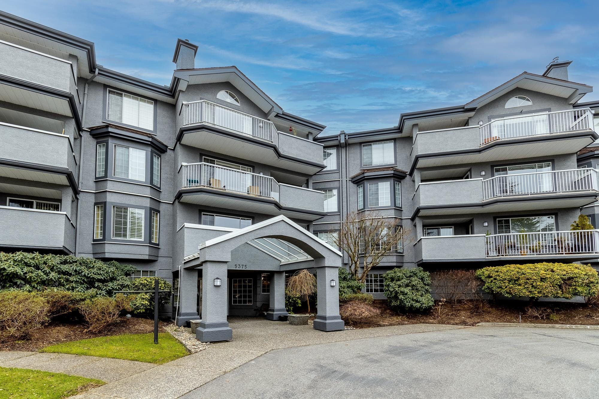 Main Photo: 111 5375 205 Street in Langley: Langley City Condo for sale in "Glenmont Park" : MLS®# R2749433