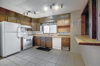 Photo 6: 32 Coach Manor Rise SW in Calgary: Coach Hill Detached for sale : MLS®# A2011473
