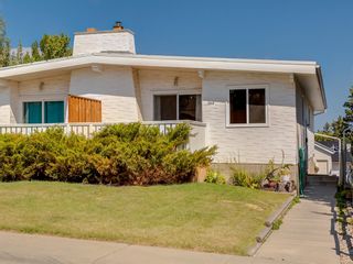 Photo 1: 2418 98 Avenue SW in Calgary: Palliser Duplex for sale : MLS®# A1025542