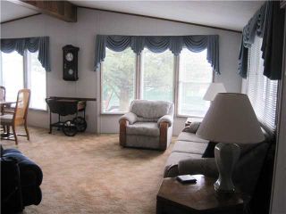 Photo 3: 109 145 KING EDWARD Street in Coquitlam: Maillardville Manufactured Home for sale in "MILL CREEK VILLAGE" : MLS®# V999995