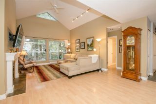 Photo 1: 404 2733 ATLIN Place in Coquitlam: Coquitlam East Condo for sale in "ATLIN COURT" : MLS®# R2232992