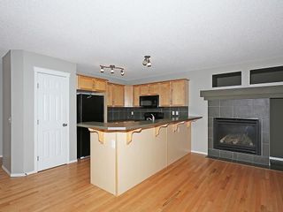 Photo 3: 89 SUNSET Heights: Cochrane House for sale : MLS®# C4177018