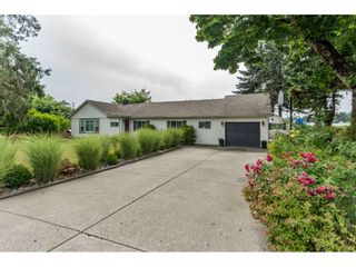 Photo 1: 703 CLEARBROOK Road in Abbotsford: Poplar House for sale : MLS®# R2387307