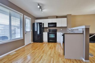 Photo 10: 59 Tuscany Springs Gardens NW in Calgary: Tuscany Row/Townhouse for sale : MLS®# A2003672