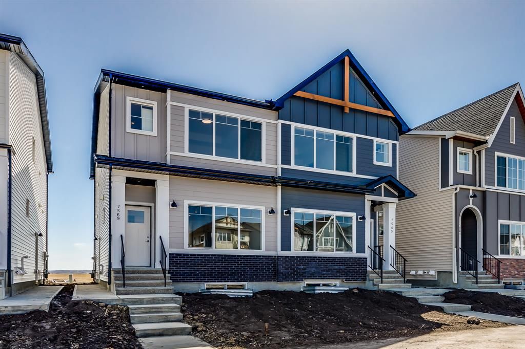 Main Photo: 7569 202 Avenue SE in Calgary: C-390 Semi Detached (Half Duplex) for sale : MLS®# A2045072