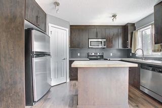 Photo 10: 49 Aspen Hills Drive in Calgary: Aspen Woods Row/Townhouse for sale : MLS®# A1108255