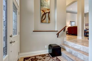 Photo 3: 33 ELMONT View SW in Calgary: Springbank Hill Semi Detached for sale : MLS®# A1061574
