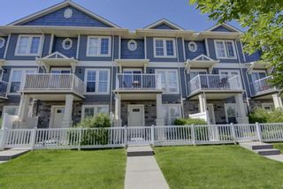 Photo 1: 653 Auburn Bay Boulevard SE in Calgary: Auburn Bay Row/Townhouse for sale : MLS®# A1147022