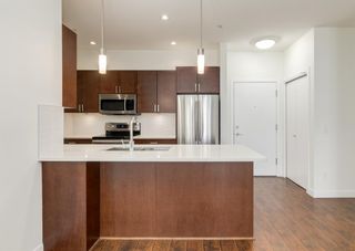 Photo 1: 307 22 Auburn Bay Link SE in Calgary: Auburn Bay Apartment for sale : MLS®# A1165962