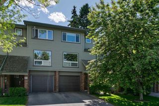 Photo 2: 109 Point Drive NW in Calgary: Point McKay Row/Townhouse for sale : MLS®# A2139335