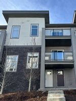 Main Photo: 128 Spring Creek Common SW in Calgary: Springbank Hill Row/Townhouse for sale : MLS®# A2109387