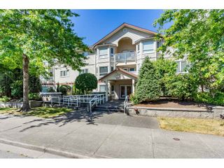 Photo 1: 210 5977 177B Street in Surrey: Cloverdale BC Condo for sale in "THE STETSON" (Cloverdale)  : MLS®# R2482496