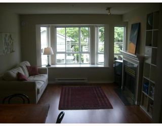 Photo 2: 214 2545 W BROADWAY BB in Vancouver: Kitsilano Townhouse for sale in "TRAFALGER MEWS" (Vancouver West)  : MLS®# V719895
