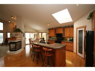 Photo 10: 315 GLENEAGLES View: Cochrane House for sale : MLS®# C4014401