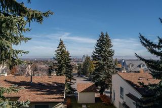Photo 1: 112 Strathlorne Mews SW in Calgary: Strathcona Park Row/Townhouse for sale : MLS®# A2087332