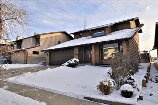 Photo 1: 7067 EDGEMONT Drive NW in Calgary: Edgemont House for sale : MLS®# C4143123