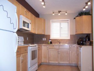Photo 8: 766 LUXSTONE Gate SW: Airdrie Residential Attached for sale : MLS®# C3414751