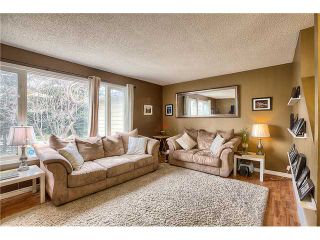 Photo 2: 869 QUEENSLAND Drive SE in CALGARY: Queensland Residential Attached for sale (Calgary)  : MLS®# C3616074