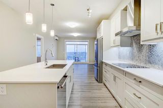 Photo 4: 404 200 Auburn Meadows Common SE in Calgary: Auburn Bay Apartment for sale : MLS®# A1151745