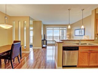 Photo 5: 1 169 Rockyledge View NW in Calgary: Rocky Ridge Row/Townhouse for sale : MLS®# A1241867