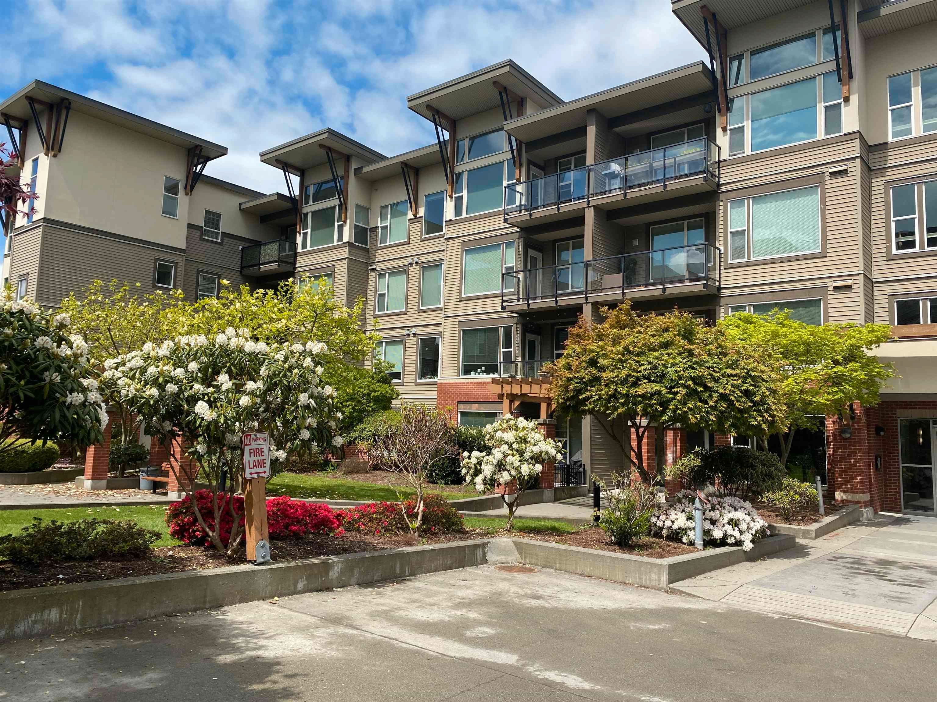 Main Photo: 211 33538 MARSHALL Road in Abbotsford: Central Abbotsford Condo for sale in "THE CROSSING A" : MLS®# R2688563