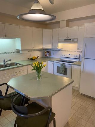 Photo 5: 220 223 Tuscany Springs Boulevard NW in Calgary: Tuscany Apartment for sale : MLS®# A1204040