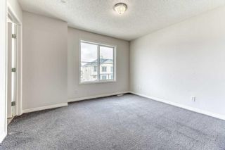 Photo 18: 156 Everhollow Heights SW in Calgary: Evergreen Row/Townhouse for sale : MLS®# A2123116