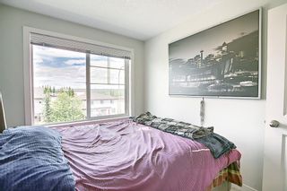 Photo 33: 2103 Jumping Pound Common: Cochrane Row/Townhouse for sale : MLS®# A1170948