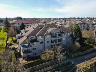 Photo 1: 208 7475 138 Street in Surrey: East Newton Condo for sale in "Cardinal Court" : MLS®# R2860380