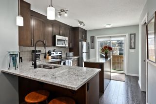 Photo 7: 107 2400 Ravenswood View SE: Airdrie Row/Townhouse for sale : MLS®# A2130554