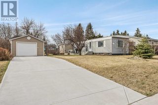 Photo 1: 1211 Downie Street in Carstairs: House for sale : MLS®# A2127071