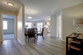 Photo 2: 6114 304 Mackenzie Way SW: Airdrie Apartment for sale : MLS®# A1156641