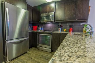 Photo 2: 104 45 Aspenmont Heights SW in Calgary: Aspen Woods Apartment for sale : MLS®# A2028160