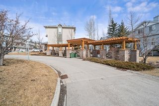 Photo 34: 76 Crystal Shores Cove: Okotoks Row/Townhouse for sale : MLS®# A1192998