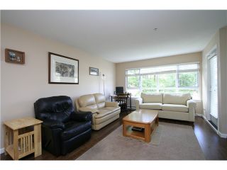 Photo 2: 207 4950 MCGEER Street in Vancouver: Collingwood VE Condo for sale in "Carleton" (Vancouver East)  : MLS®# V974793
