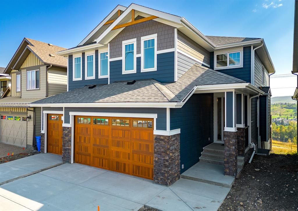 Main Photo: 306 Rowley Way NW in Calgary: C-483 Detached for sale : MLS®# A2001387
