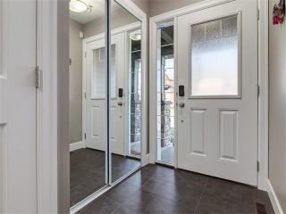 Photo 3: 18 WINDWOOD Grove SW: Airdrie House for sale : MLS®# C4082940