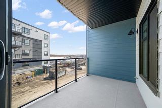 Photo 10: 50 Cranbrook Gardens SE in Calgary: Cranston Row/Townhouse for sale : MLS®# A2037909