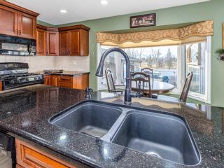 Photo 9: 411 Wilkinson Place SE in Calgary: Willow Park Detached for sale : MLS®# A2096753