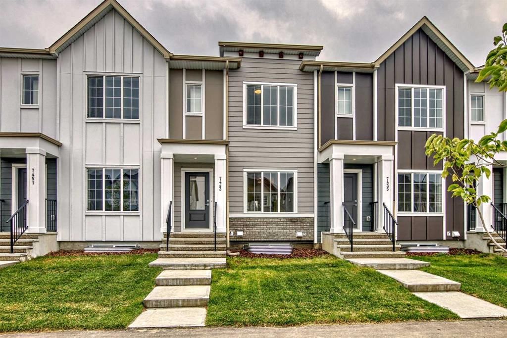 Main Photo: 7443 202 Avenue SE in Calgary: C-390 Row/Townhouse for sale : MLS®# A2077842