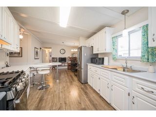 Photo 11: 17 8670 156 Street in Surrey: Fleetwood Tynehead Manufactured Home for sale in "WESTWOOD COURT" : MLS®# R2612269