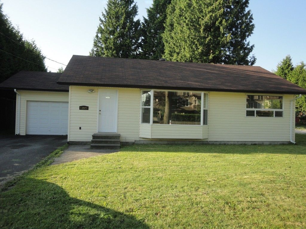 Front Exterior: Nice large yard with access to heated, covered garage.  Ample room for extra 4 cars on driveway
