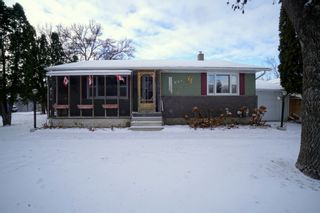 Photo 1: 615 Midland Street in Portage la Prairie: House for sale : MLS®# 202331954