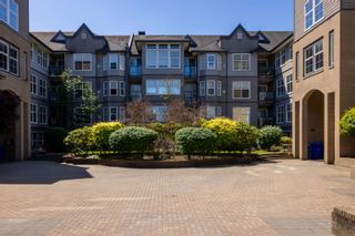Photo 2: 410 20200 56 Avenue in Langley: Langley City Condo for sale in "The Bentley" : MLS®# R2785545
