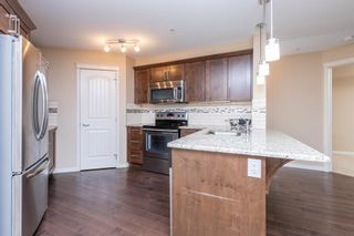Photo 3: 1210 130 Panatella Street NW in Calgary: Panorama Hills Apartment for sale : MLS®# A2000569