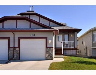Photo 1: 579 STONEGATE Way NW: Airdrie Residential Attached for sale : MLS®# C3397152